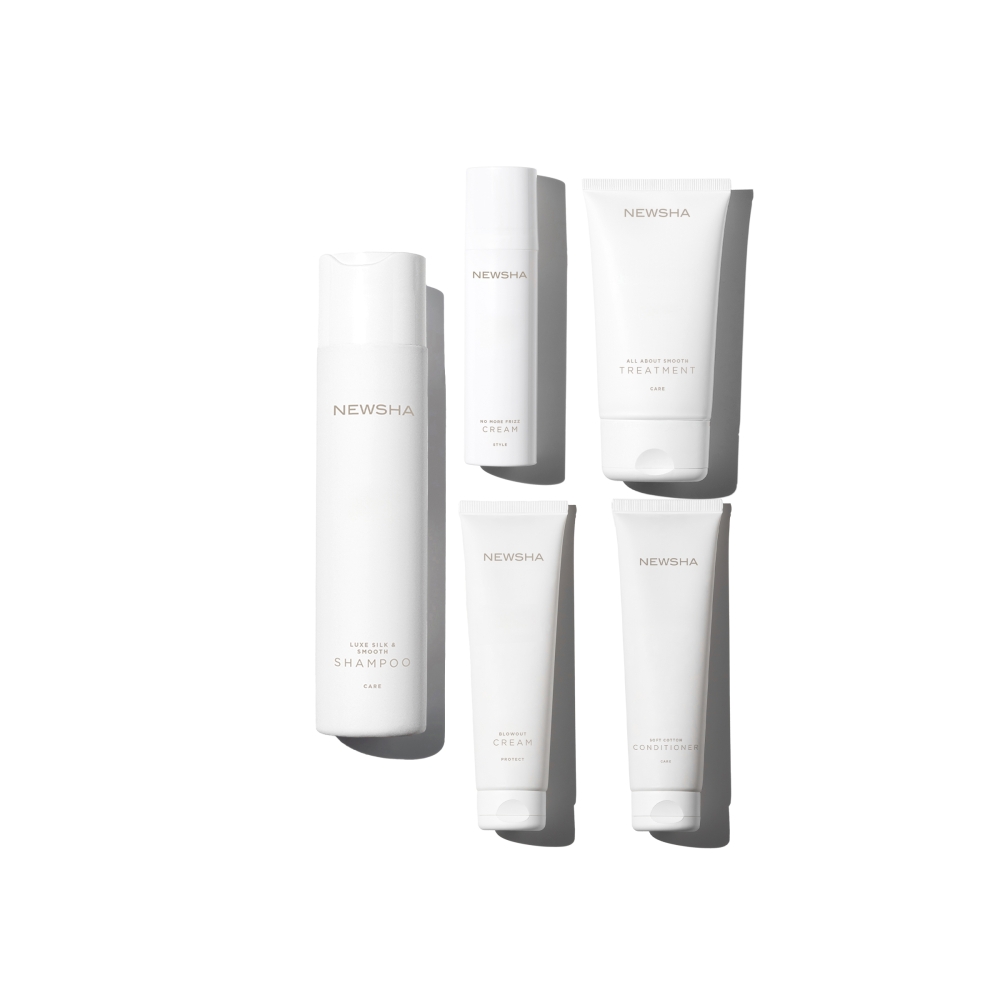 Pflegeset für geschmeidiges, glattes Haar mit Anti-Frizz-Wirkung. Luxe Silk & Smooth Shampoo, No More Frizz Cream, All About Smooth Treatment und weitere Haarpflegeprodukte von NEWSHA für glanzvolles Styling und seidige Haarstruktur.