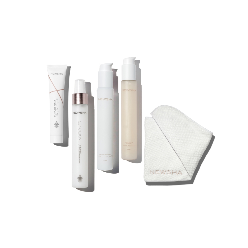 Haarpflege-Set mit Shampoo, Conditioner und Treatment von NEWSHA. Hochwertige Pflegeprodukte für gesundes, glänzendes Haar inklusive Mikrofaser-Handtuch für die tägliche Haarpflege.