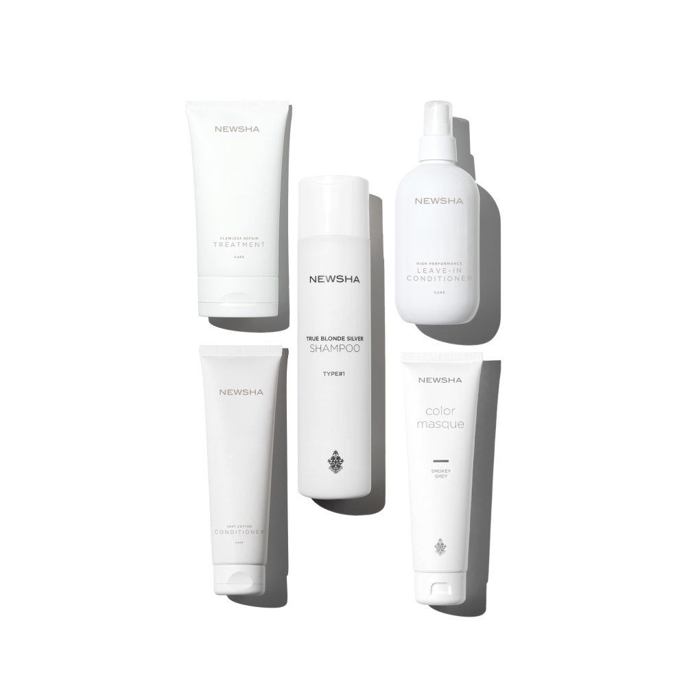 Silbershampoo für blondiertes Haar mit Pflegeprodukten für kühle Farbreflexe. True Blonde Silver Shampoo von NEWSHA im Set mit Soft Cotton Conditioner, Smokey Grey Color Masque und Leave-in Conditioner für strahlendes, gesundes Blond.